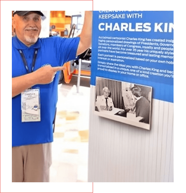 Man in blue shirt pointing at a display board titled 'Kepsake with Charles King'.